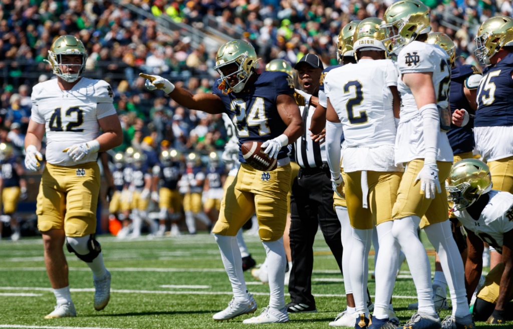 Notre Dame running back Jadarian Price (24) celebrates getting a first down during the Notre Dame Blue-Gold spring football game at Notre Dame Stadium on Saturday, April 12, 2025, in South Bend.