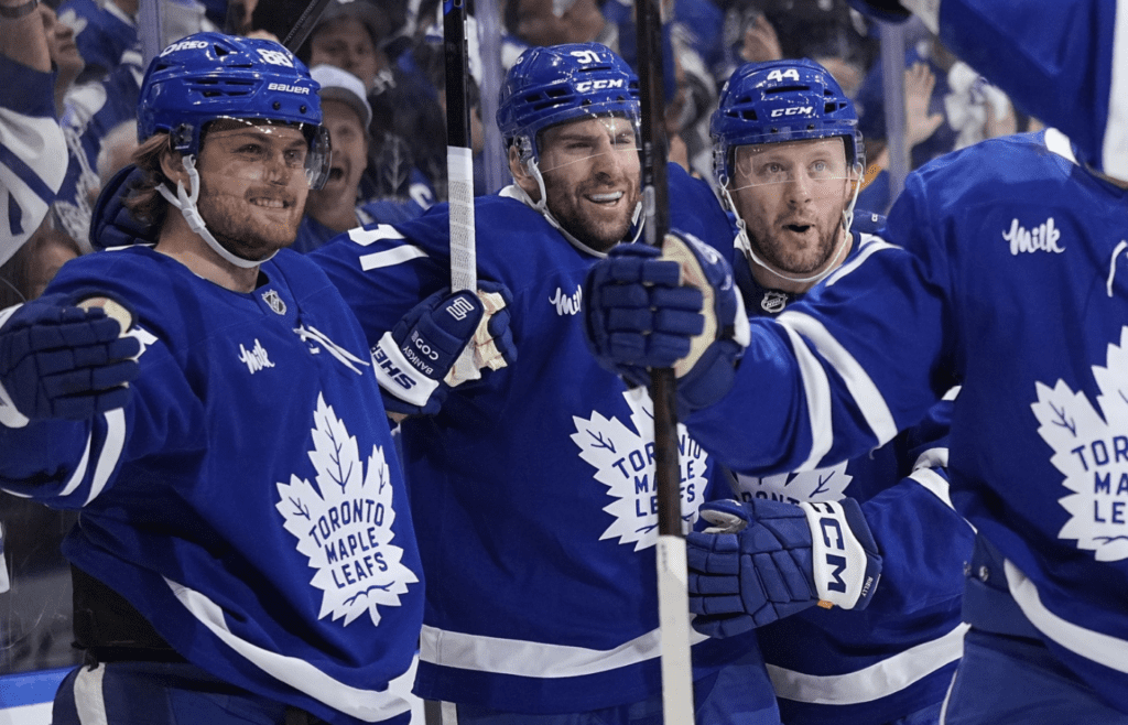 May 5, 2025; Toronto, Ontario, CAN; Toronto Maple Leafs forward William Nylander (88) celebrates with defenseman Morgan Rielly (44) and forward John Tavares (91) after his second goal of the first period against the Florida Panthers during the second round of the 2025 Stanley Cup Playoffs at Scotiabank Arena. Mandatory Credit: John E. Sokolowski-Imagn Images