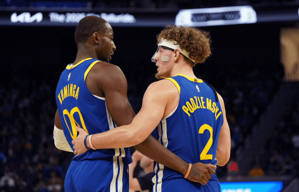 Oct 30, 2024; San Francisco, California, USA; Golden State Warriors forward Jonathan Kuminga (00) huddles with guard Brandin Podziemski (2) during the game against New Orleans Pelicans during the fourth quarter at Chase Center. Mandatory Credit: David Gonzales-Imagn Images