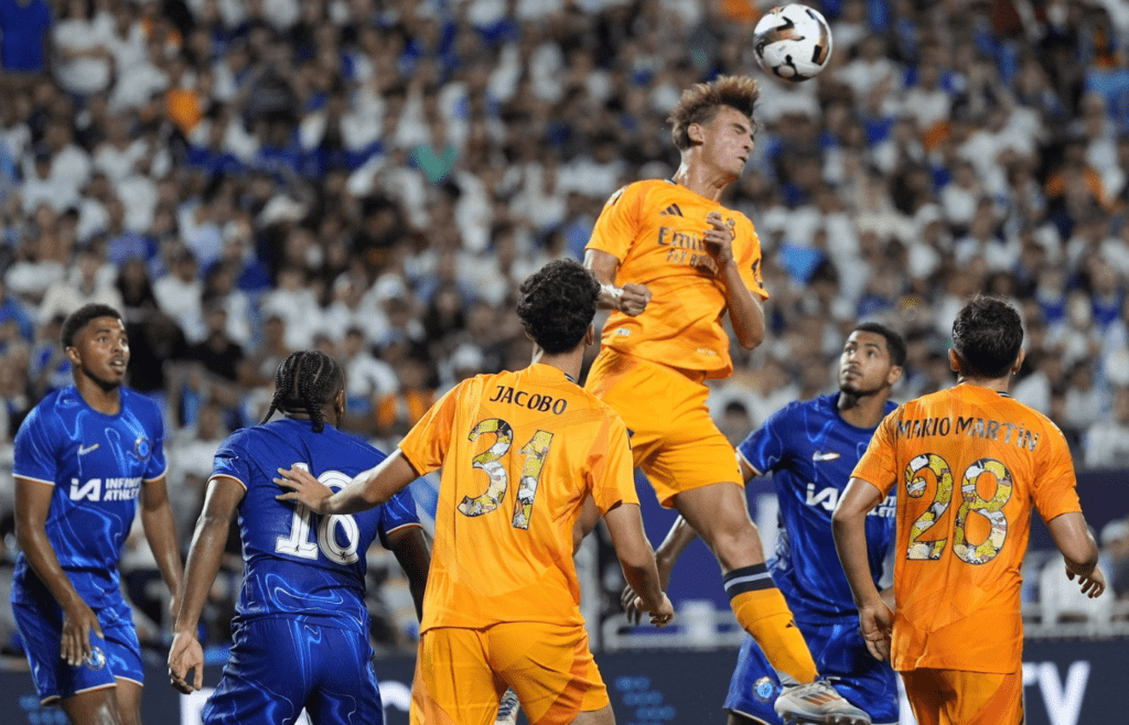 Aug 6, 2024; Charlotte, NC, USA; Real Madrid attacker Nico Paz (27) gets a header against Chelsea during the second half at Bank of America Stadium. Mandatory Credit: Jim Dedmon-Imagn Images