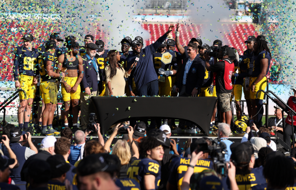 Dec 31, 2024; Tampa, FL, USA; Michigan Wolverines head coach Sherrone Moore celebrates after beating the Alabama Crimson Tide in the ReliaQuest Bowl at Raymond James Stadium. Mandatory Credit: Nathan Ray Seebeck-Imagn Images