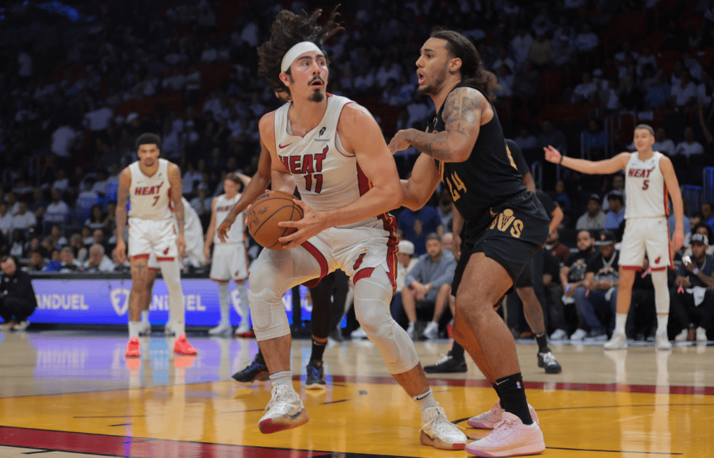 Apr 28, 2025; Miami, Florida, USA; Miami Heat guard Jaime Jaquez Jr. (11) drives to the basket against Cleveland Cavaliers forward Jaylon Tyson (24) in the fourth quarter during game four for the first round of the 2025 NBA Playoffs at Kaseya Center. Mandatory Credit: Sam Navarro-Imagn Images