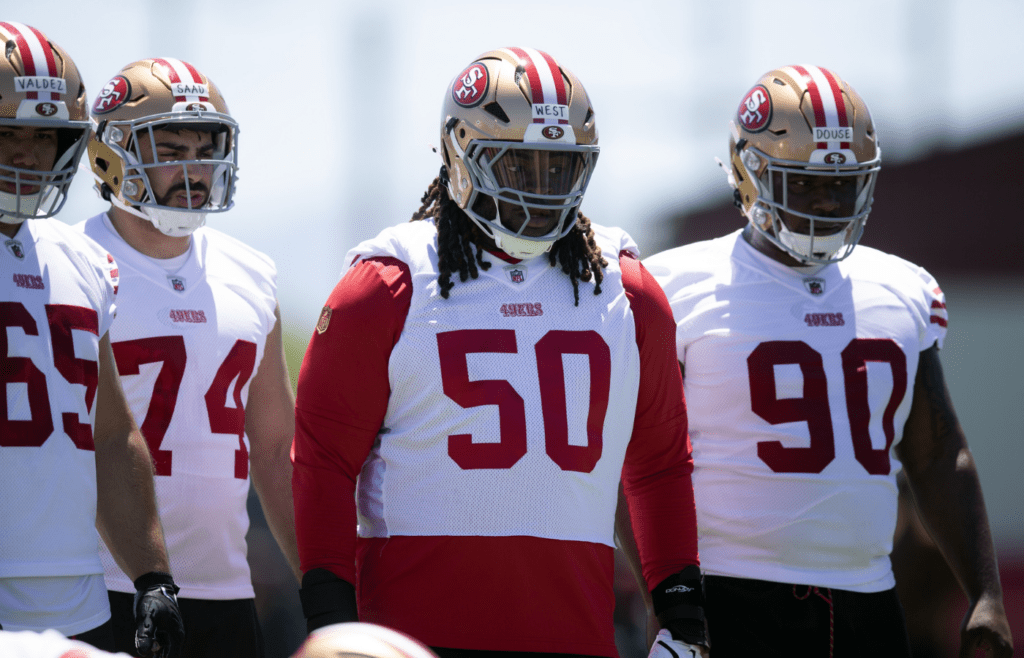 May 9, 2025; Santa Clara, CA, USA; San Francisco 49ers defensive line tryouts Sebastian Valdez (65), Ali Saad (74), C.J. West (50) and DíQuan Douse (90) wait for their turn at a blocking drill during the teamís rookie minicamp. Mandatory Credit: D. Ross Cameron-Imagn Images