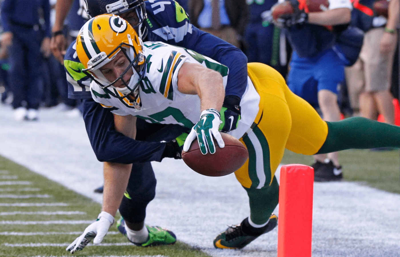 Green Bay Packers wide receiver Jordy Nelson (87) reaches but comes up just short during the 1st quarter of the Green Bay Packers game against the Seattle Seahawks Thursday, September 4, 2014 at CenturyLink Field in Seattle, Wash.