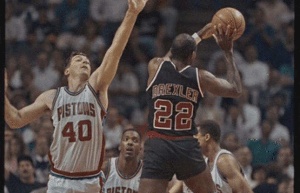 06/07/1990; Detroit, Michigan, USA; Trailblazers' Clyde Drexler looks to pass the ball while being guarded Pistons' Bill Laimbeer in game two of the NBA Final, Mandatory Credit: Archie, Detroit Free Press, USA Today Network