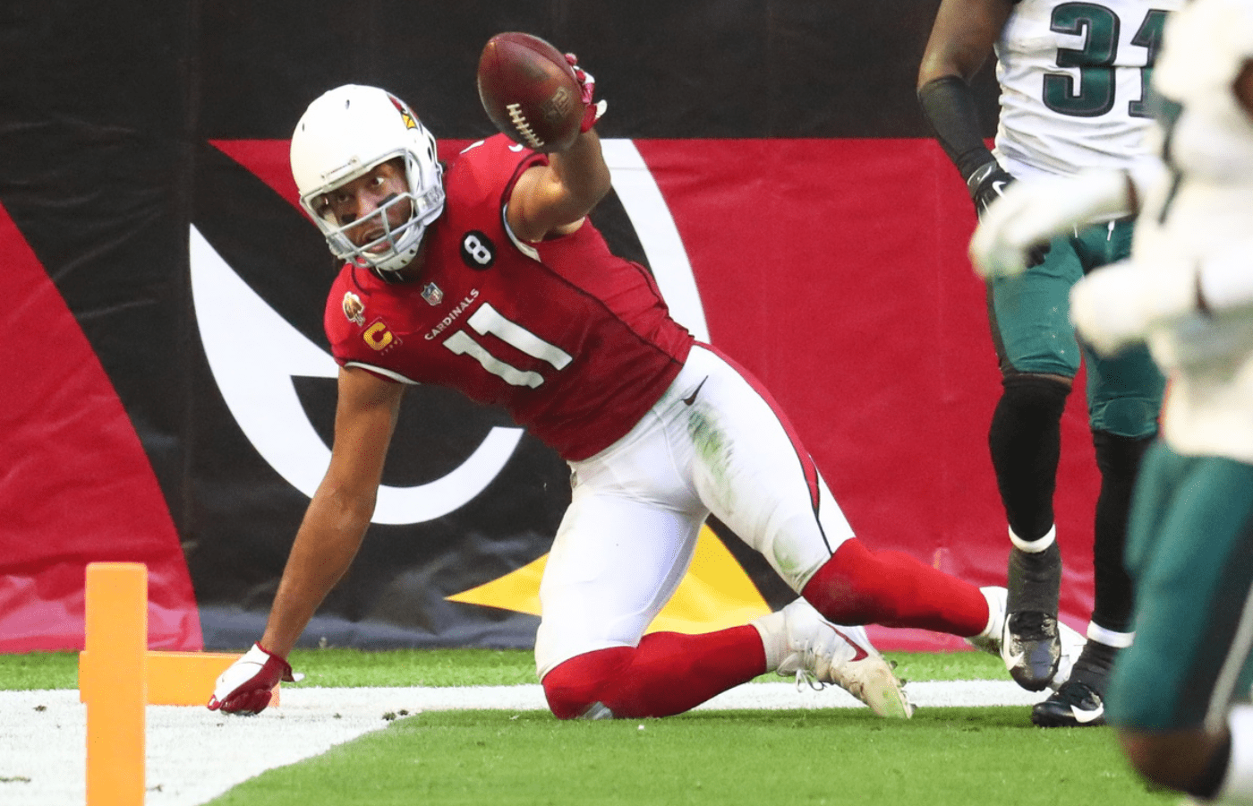 Dec 20, 2020; Glendale, Arizona, USA; Arizona Cardinals wide receiver Larry Fitzgerald (11) scores a touchdown against the Philadelphia Eagles in the first half at State Farm Stadium. Mandatory Credit: Mark J. Rebilas-Imagn Images