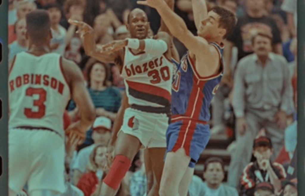 06/10/1990; Portland, Oregon USA; Trailblazers Terry Porter passes the ball toward Clifford Robinson with Pistons'' Bill Laimbeer trying to block the pass during game three of the 1990 NBA Finals at The Memorial Coliseum. Mandatory Credit: William Archie -Detroit Free Press