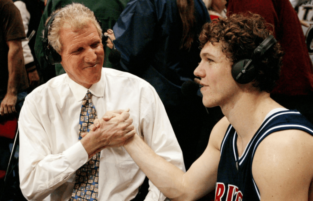ESPN broadcaster Bill Walton shakes hands with his son Luke after Arizona beat San Diego State 89-81 at Cox Arena on Dec.