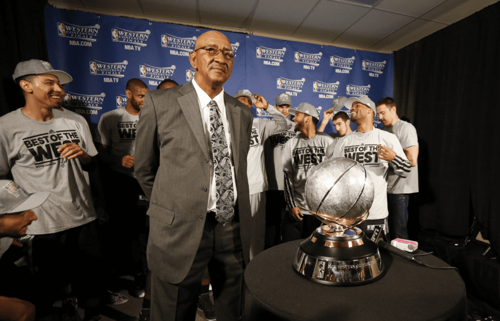 May 27, 2013; Memphis, TN, USA; San Antonio Spurs former player George Gervin stands with current Spurs players and the Western Conference championship trophy after game four of the Western Conference finals of the 2013 NBA Playoffs against the Memphis Grizzlies at FedEx Forum. The Spurs won 93-86. Mandatory Credit: Rogelio V. Solis/Pool Photo-Imagn Images