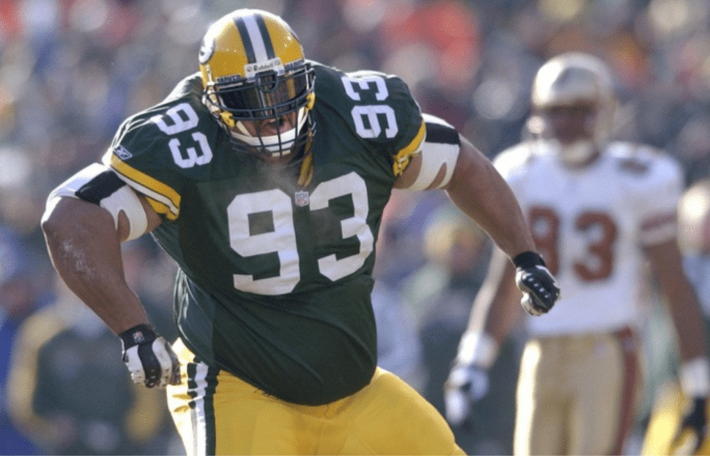 Green Bay Packers defensive tackle Gibert Brown celebrates his sacking of quarterback Jeff Garcia in the first play of the game. The Green Bay Packers defeated San Francisco, 25-15, on Sunday, Jan. 13th, 2002, at Lambeau Field, in the first round of the playoffs.