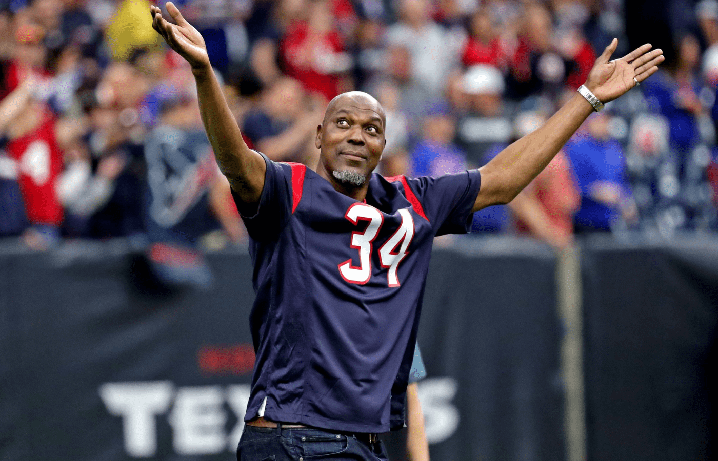 an 4, 2020; Houston, Texas, USA; Houston Rockets former player Hakeem Olajuwon cheers before the AFC Wild Card NFL Playoff game between the Houston Texans and the Buffalo Bills at NRG Stadium. Mandatory Credit: Kevin Jairaj-Imagn Images