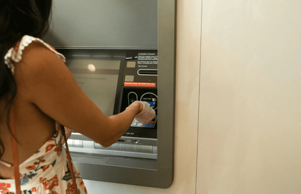 Woman Using An ATM Machine