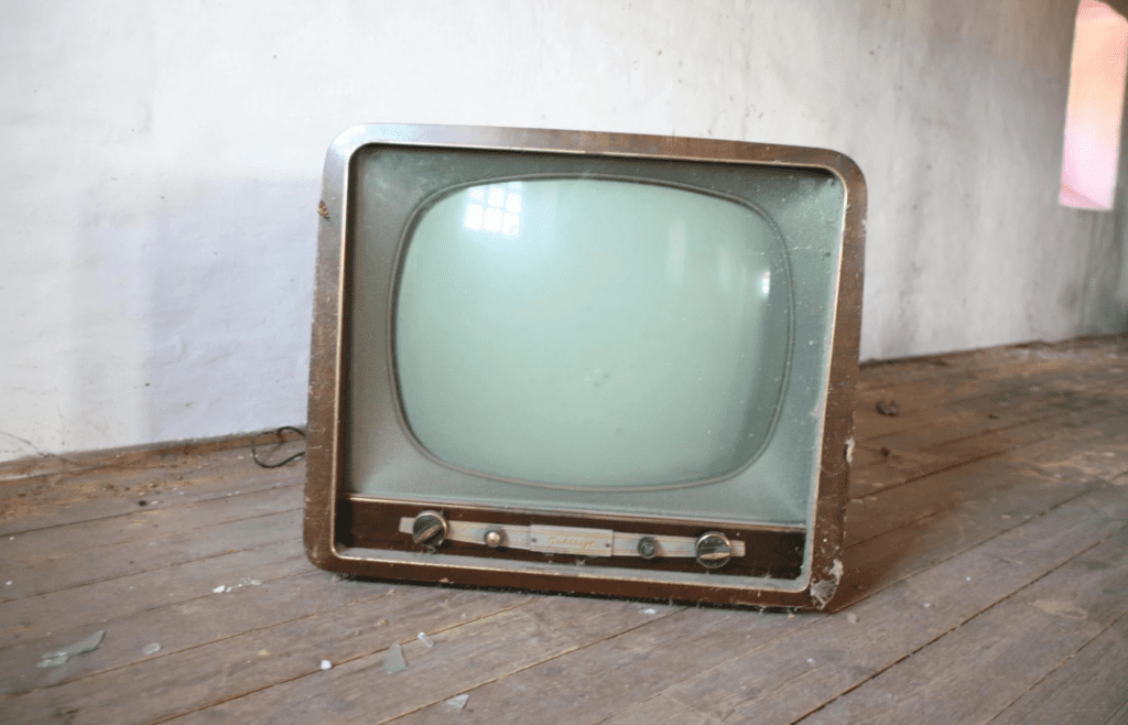 Vintage Brown Crt Tv on Parquet Wood Flooring