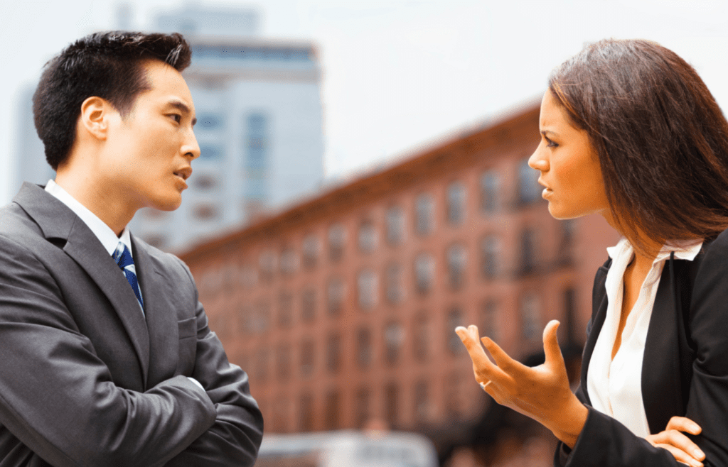 Someone frustrated while another person shrugs dismissively
