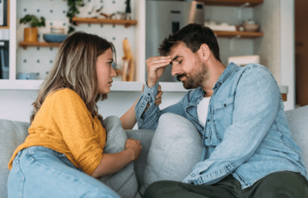 A concerned person talking to someone looking frustrated
