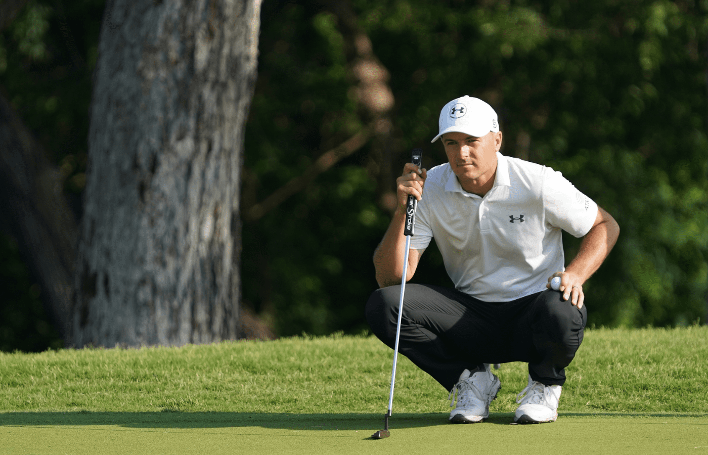 May 22, 2025; Fort Worth, Texas, USA; Jordan Spieth lines up a putt on the 12th green during the first round of the Charles Schwab Challenge golf tournament. Mandatory Credit: Raymond Carlin III-Imagn Images