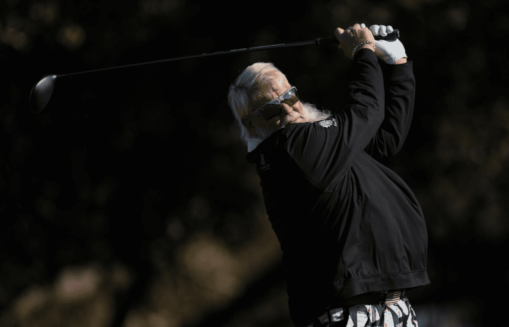 John Daly hits a tee shot on the second hole during the PNC Championship at The Ritz-Carlton Golf Club