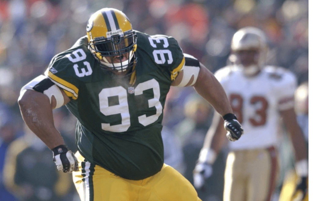 Green Bay Packers defensive tackle Gibert Brown celebrates his sacking of quarterback Jeff Garcia in the first play of the game. The Green Bay Packers defeated San Francisco, 25-15, on Sunday, Jan. 13th, 2002, at Lambeau Field, in the first round of the playoffs