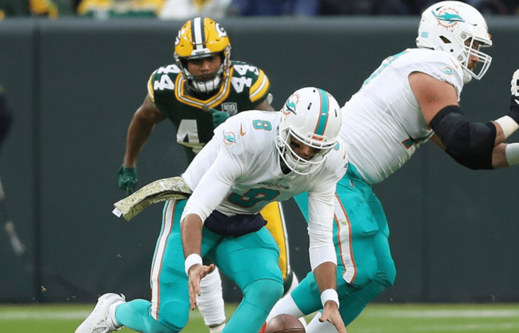 Miami Dolphins quarterback Brock Osweiler (8) scrambles after a fumbled snap against the Packers at Lambeau Field Sunday, November 11, 2018 in Green Bay, Wis. Jim Matthews/USA TODAY NETWORK-Wis 39 111118 Pack V Miami 14536
