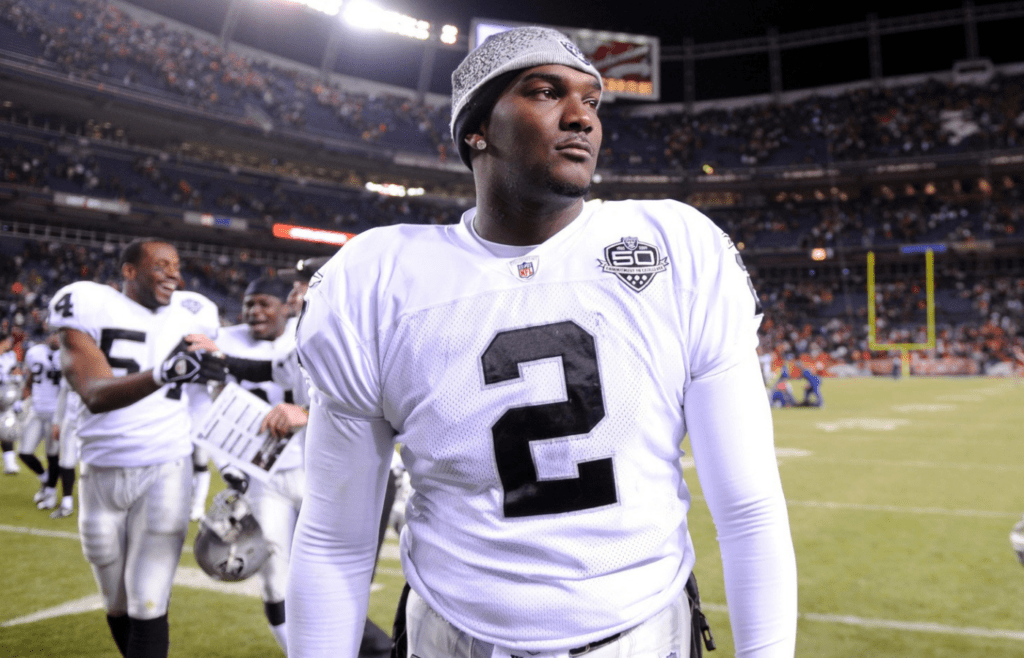 Dec 20, 2009; Denver, CO, USA; Oakland Raiders quarterback JaMarcus Russell (2) walks off the field after the Raiders' 20-19 victory over the Denver Broncos at Invesco Field. Mandatory Credit: Kirby Lee/Image of Sport-Imagn Images
