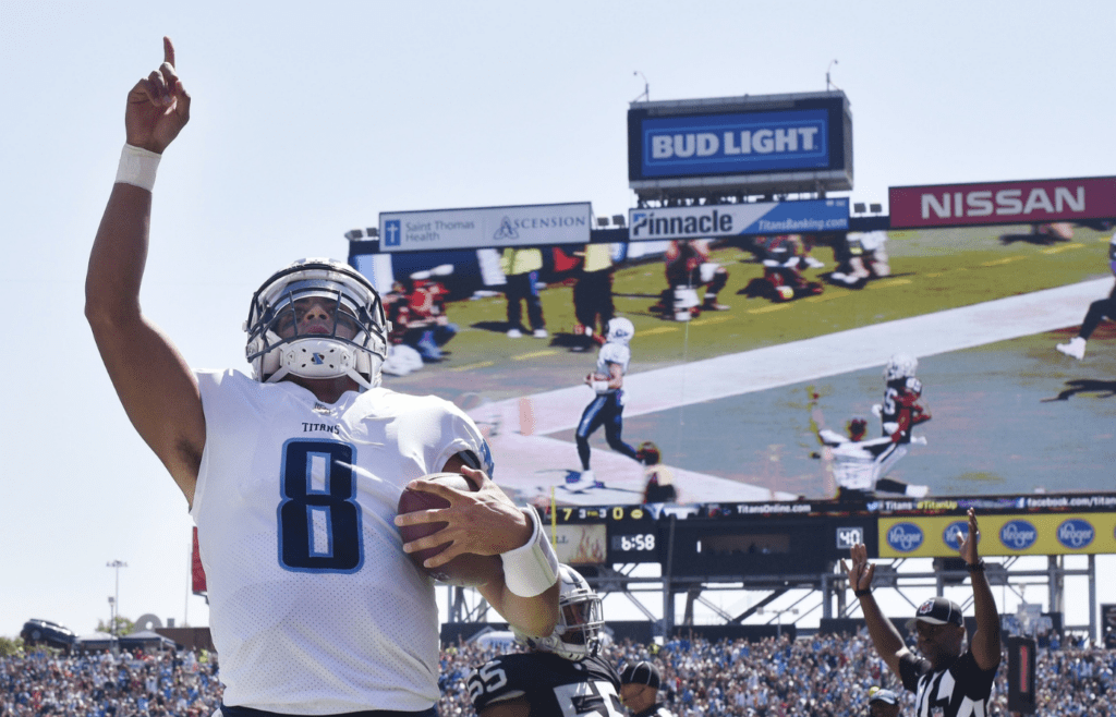Tennessee Titans quarterback Marcus Mariota (8) celebrates his touchdown against the Oakland Raiders at Nissan Stadium in Nashville on Sept. 10, 2017. The Titans lost their home and season opener 26-16