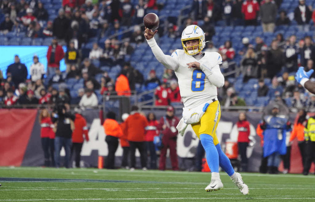 Dec 28, 2024; Foxborough, Massachusetts, USA; Los Angeles Chargers quarterback Taylor Heinicke (8) throws the ball against the New England Patriots during the second half at Gillette Stadium. Mandatory Credit: Gregory Fisher-Imagn Images
