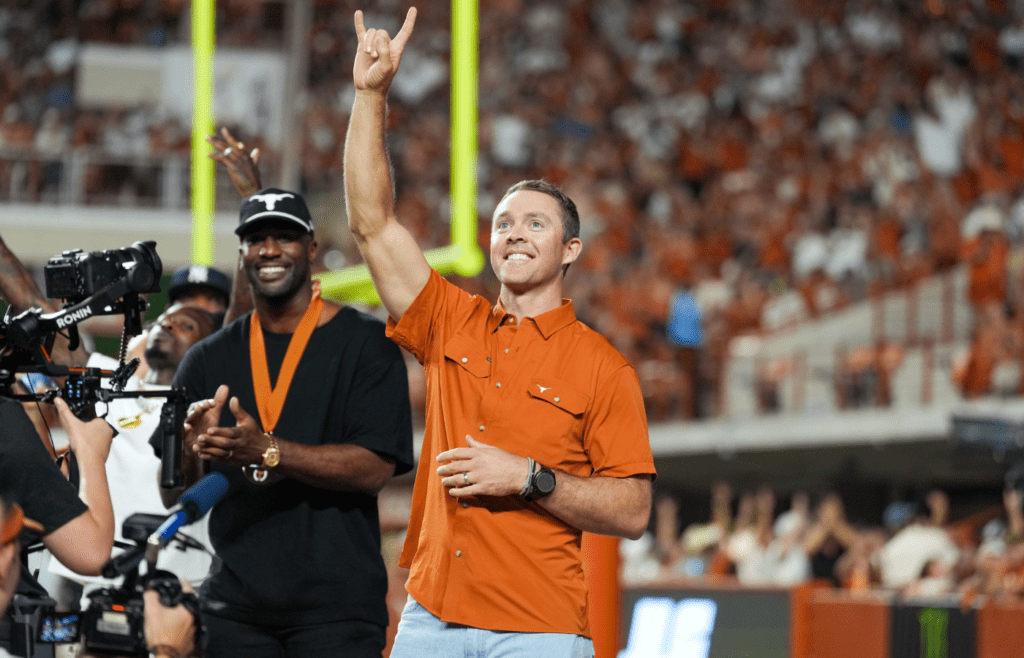 Sep 21, 2024; Austin, Texas, USA; Former Texas Longhorns quarterback Colt McCoy acknowledges the crowd after being introduced as a member of the Texas Longhorns Hall of Fame during the first half of the game against the Louisiana Monroe Warhawks at Darrell K Royal-Texas Memorial Stadium. Mandatory Credit: Daniel Dunn-Imagn Images