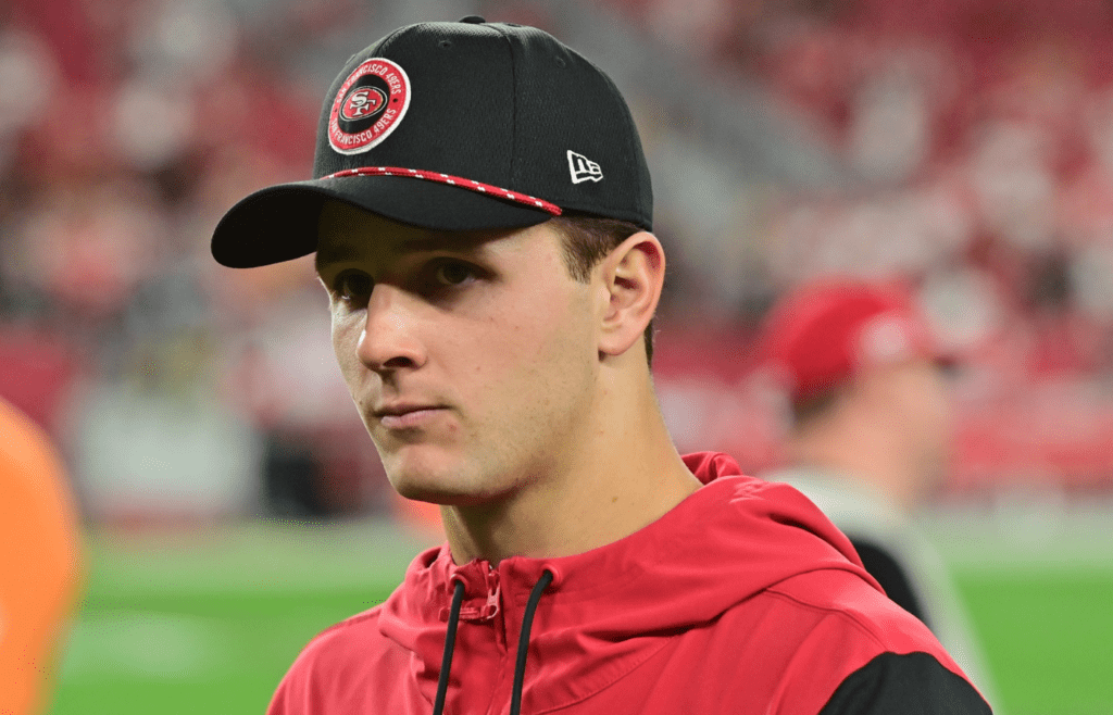Jan 5, 2025; Glendale, Arizona, USA; San Francisco 49ers quarterback Brock Purdy (13) looks on after losing to the Arizona Cardinals at State Farm Stadium. Mandatory Credit: Matt Kartozian-Imagn Images