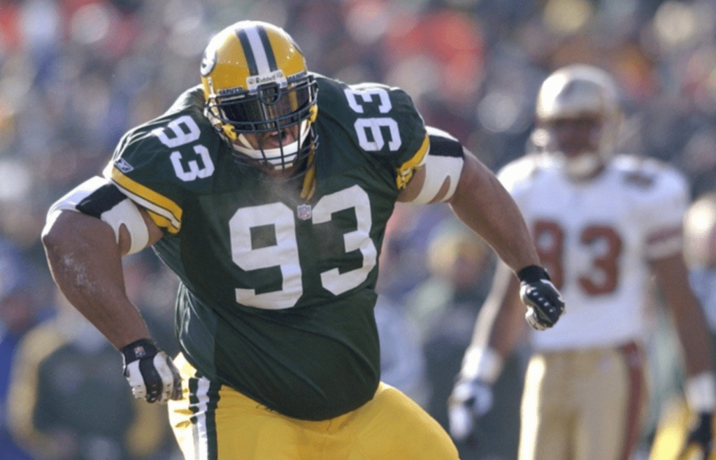 Green Bay Packers defensive tackle Gibert Brown celebrates his sacking of quarterback Jeff Garcia in the first play of the game. The Green Bay Packers defeated San Francisco, 25-15, on Sunday, Jan. 13th, 2002, at Lambeau Field, in the first round of the playoffs