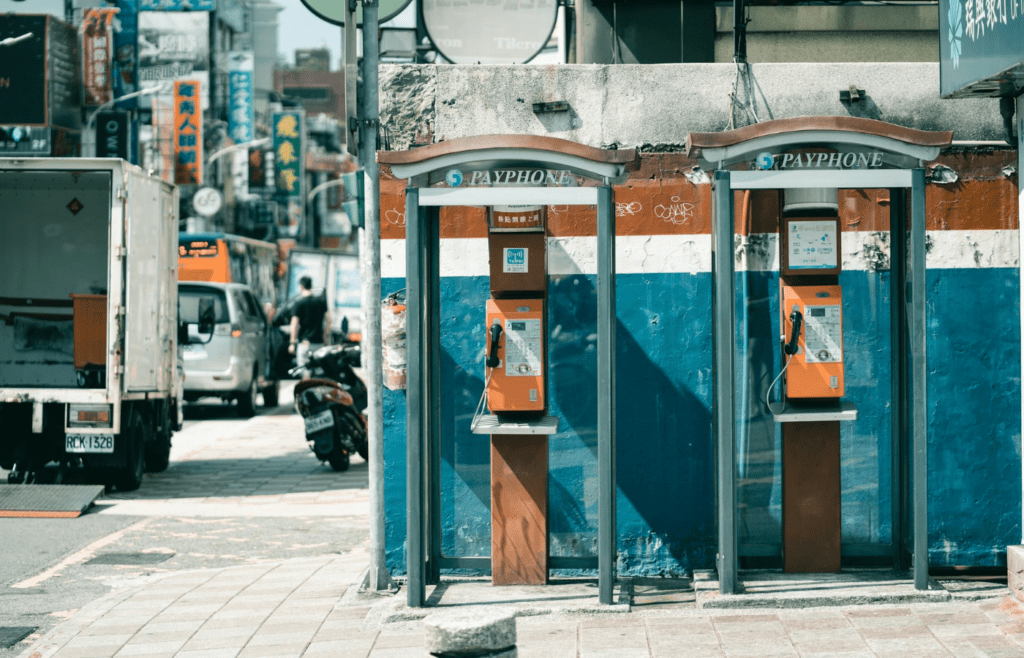 An old payphone booth on a city street