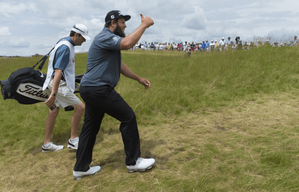 Jun 17, 2017; Hartford, WI, USA; Andrew Johnston responds to cheers of "Beef" while walking to the first tee during the third round of the 2017 U.S. Open Championship at Erin Hills. Mandatory Credit: Mark Hoffman/Milwaukee Journal Sentinel via USA TODAY NETWORK