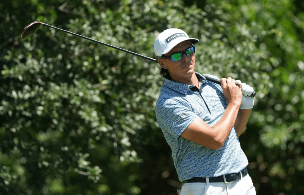 May 23, 2025; Fort Worth, Texas, USA; Rickie Fowler watches his shot from the ninth tee during the second round of the Charles Schwab Challenge golf tournament. Mandatory Credit: Jim Cowsert-Imagn Images