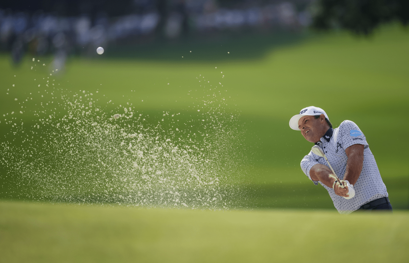 May 16, 2025; Charlotte, North Carolina, USA; Patrick Reed hits his ball out of the bunker on the fifteenth hole during the second round of the PGA Championship golf tournament at Quail Hollow. Mandatory Credit: Aaron Doster-Imagn Images