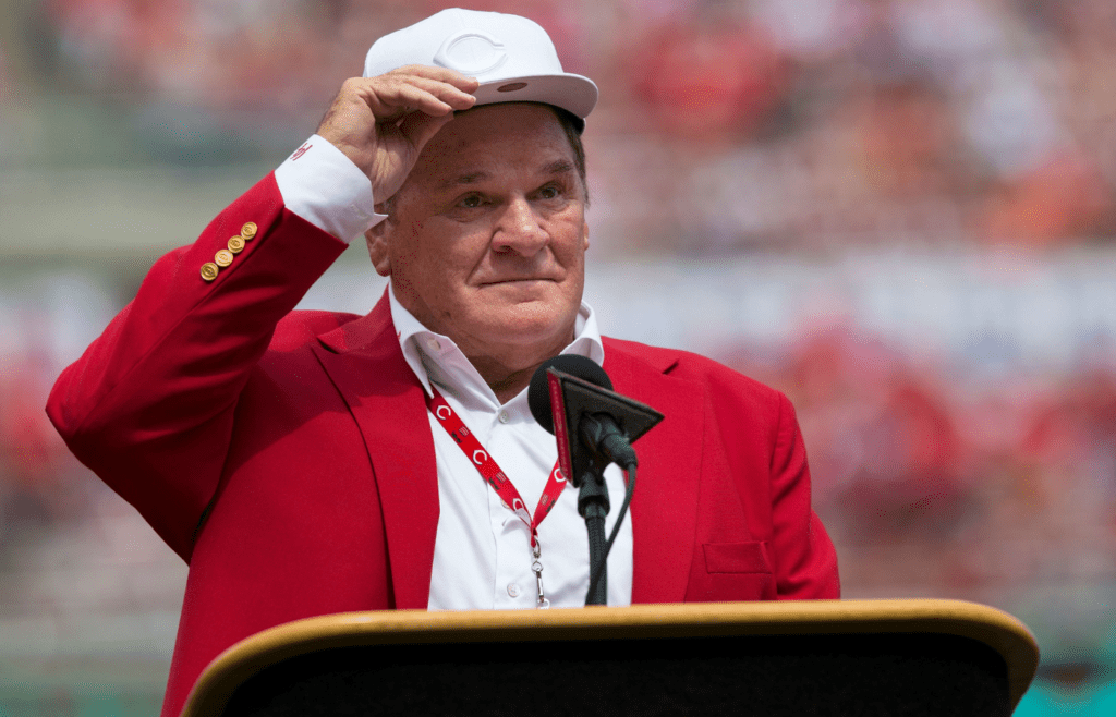 An emotional Cincinnati Reds hall of famer Pete Rose adjusts his cap as he takes the microphone during a pregame ceremony for the unveiling of Pete Rose's bronze statue being installed outside the stadium before the MLB National League game between the Cincinnati Reds and the Los Angeles Dodgers at Great American Ball Park in downtown Cincinnati on Saturday, June 17, 2017.Pete Rose