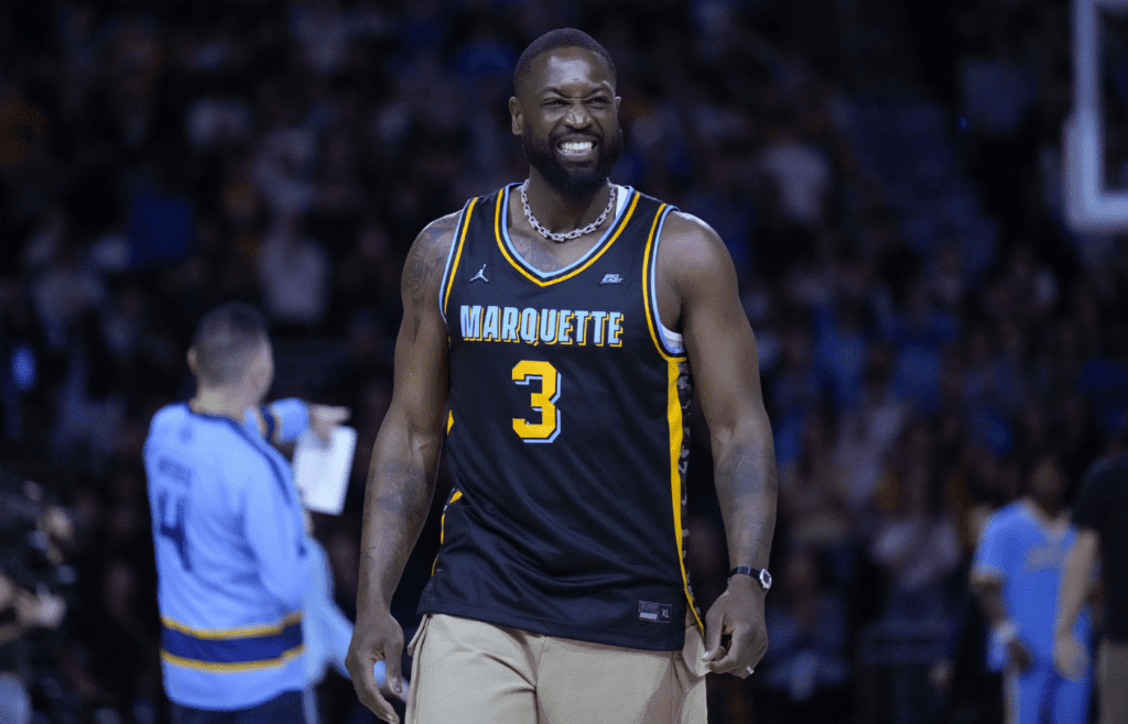 Feb 25, 2025; Milwaukee, Wisconsin, USA; Former Marquette Golden Eagles player Dwyane Wade smiles timeout during the first half of the game against the Providence Friars at Fiserv Forum. Mandatory Credit: Jeff Hanisch-Imagn Images