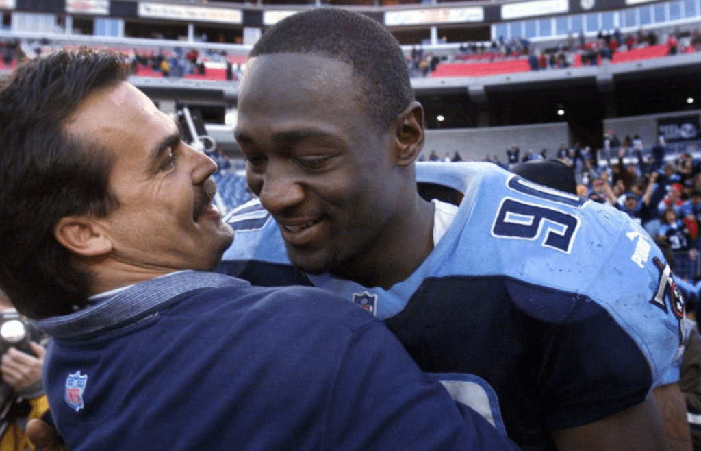 Titans head coach Jeff Fisher gives rookie Jevon Kearse a hug after a 1999 game against the Falcons. He was the Titans first-round draft pick in 1999