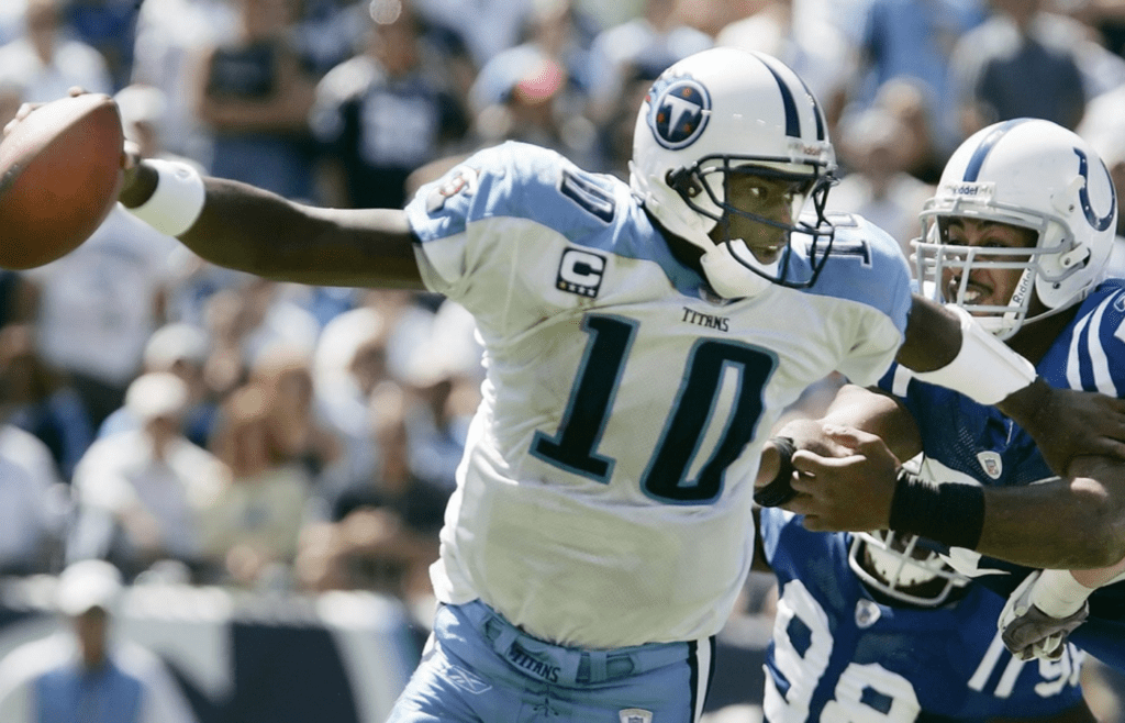 Tennessee Titans quarterback Vince Young (10) scrambles to get away from Indianapolis colts defenders at LP field in Nashville on Sept 16, 2007. The Titans lost their home opener 22-20.