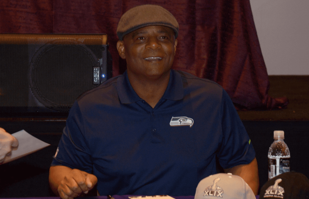 Jan 25, 2015; Phoenix, AZ, USA; Seattle Seahawks radio announcer and pro football hall of fame quarterback Warren Moon signs autographs at the NFL Experience at Phoenix Convention Center in advance of Super Bowl XLIX between the Seattle Seahawks and the New England Patriots. Mandatory Credit: Kirby Lee-Imagn Images