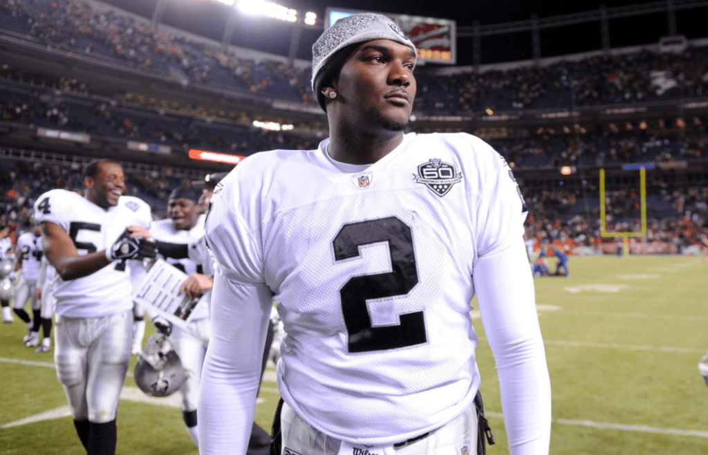 Dec 20, 2009; Denver, CO, USA; Oakland Raiders quarterback JaMarcus Russell (2) walks off the field after the Raiders' 20-19 victory over the Denver Broncos at Invesco Field. Mandatory Credit: Kirby Lee/Image of Sport-Imagn Images