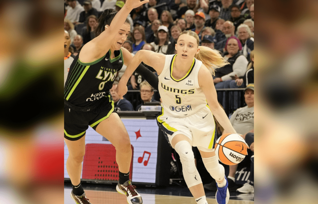 May 21, 2025; Minneapolis, Minnesota, USA; Dallas Wings guard Paige Bueckers (5) drives to the basket past Minnesota Lynx forward Bridget Carleton (6) in the second quarter at Target Center. Mandatory Credit: Bruce Kluckhohn-Imagn Images