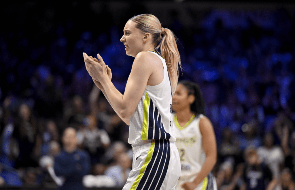 May 19, 2025; Arlington, Texas, USA; Dallas Wings guard Paige Bueckers (5) celebrates during the first half against the Seattle Storm at College Park Center. Mandatory Credit: Jerome Miron-Imagn Images