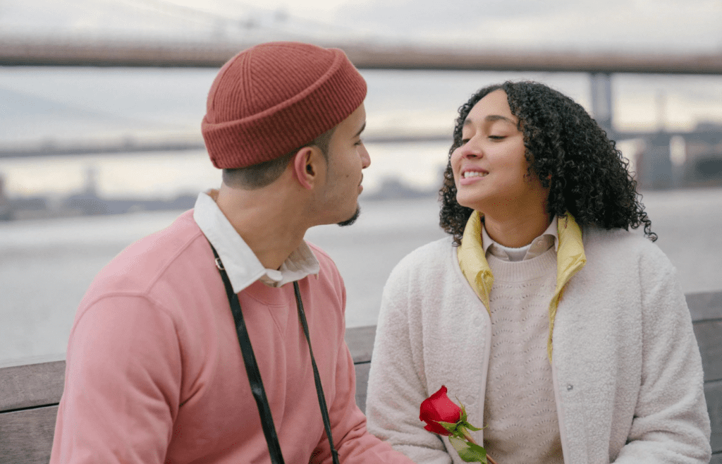 A person smiling smugly while the other looks uncomfortable