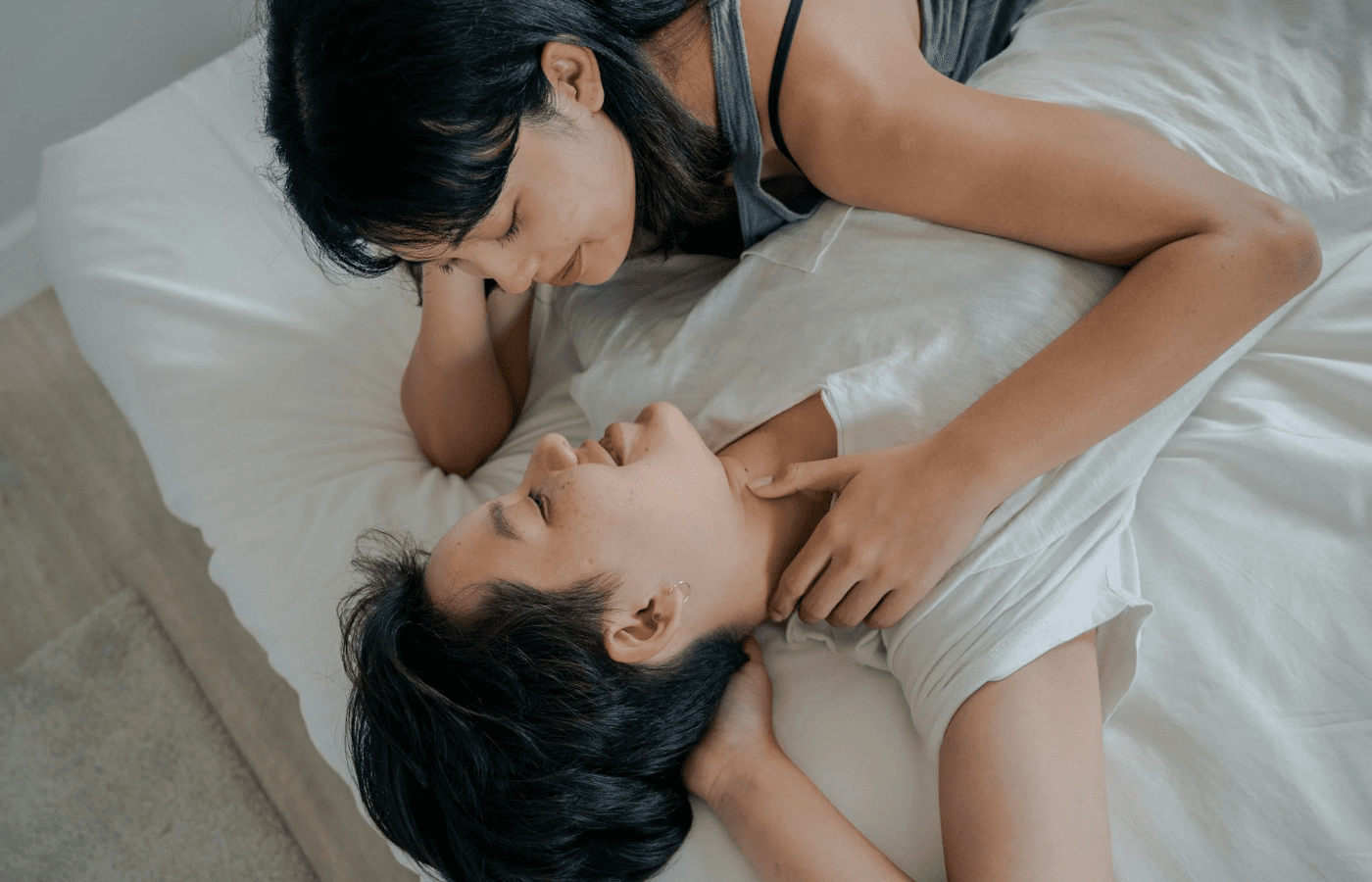 A couple in an intimate moment, one looking touched