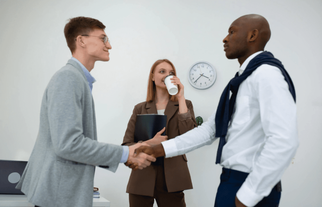 A person laughing off an insult while the other looks upset