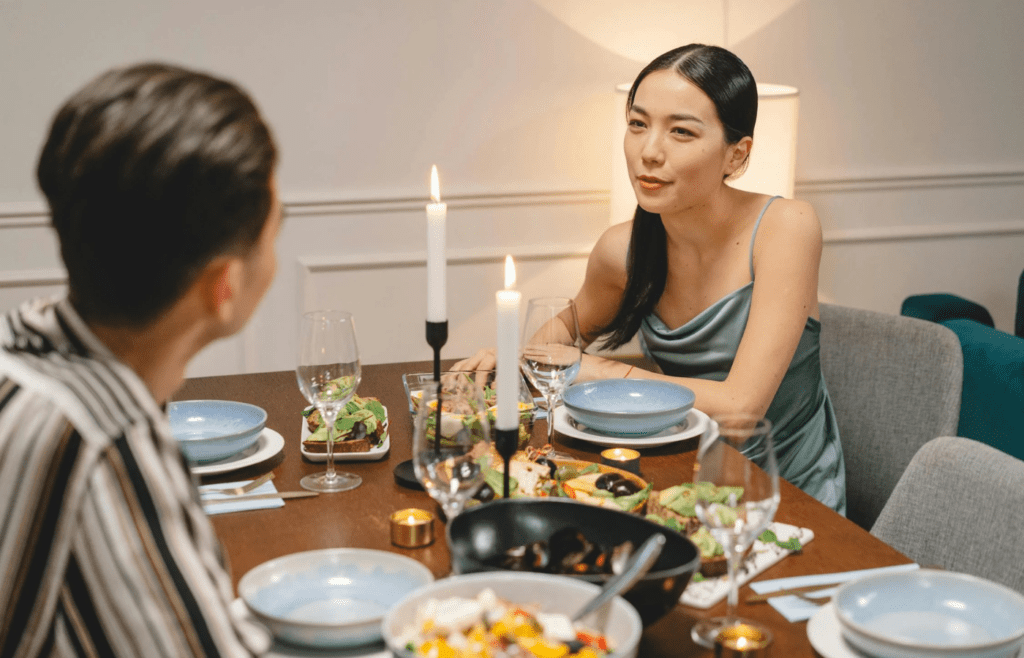 A couple looking bored or disconnected at dinner