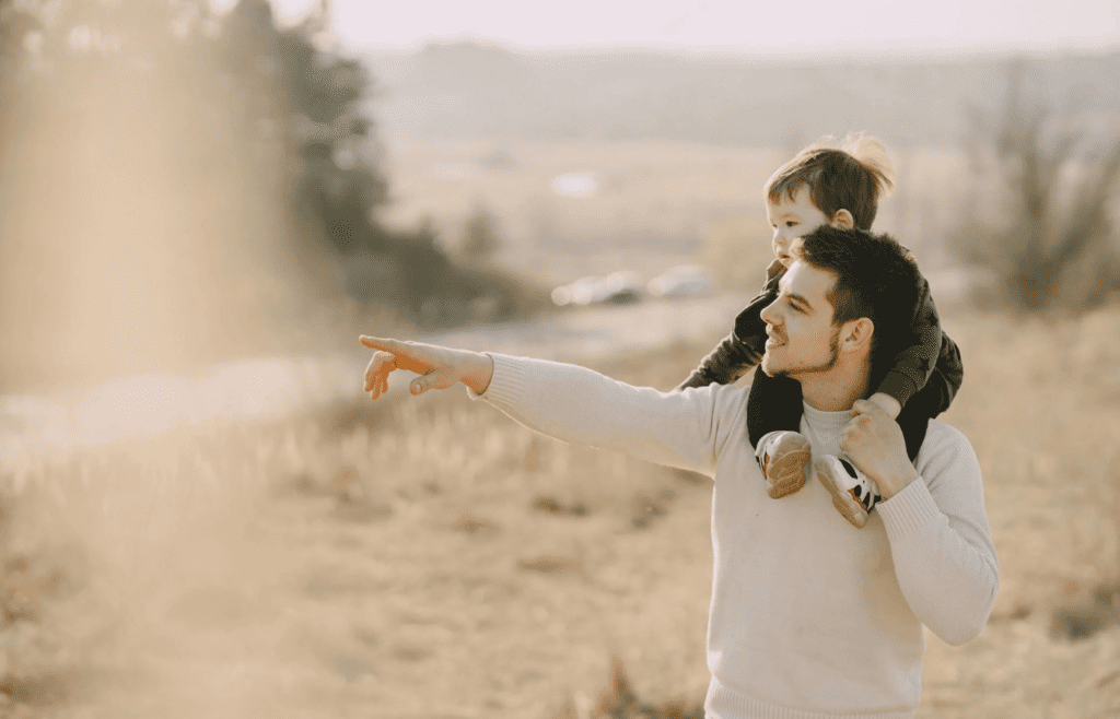 A parent pointing at a child who looks scared