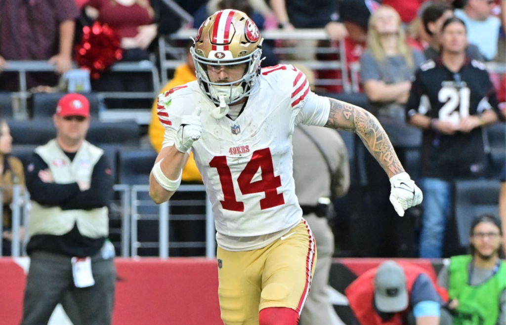 Jan 5, 2025; Glendale, Arizona, USA; San Francisco 49ers wide receiver Ricky Pearsall (14) and quarterback Joshua Dobbs (5) celebrate after connecting for a touchdown in the first half against the Arizona Cardinals at State Farm Stadium. Mandatory Credit: Matt Kartozian-Imagn Images