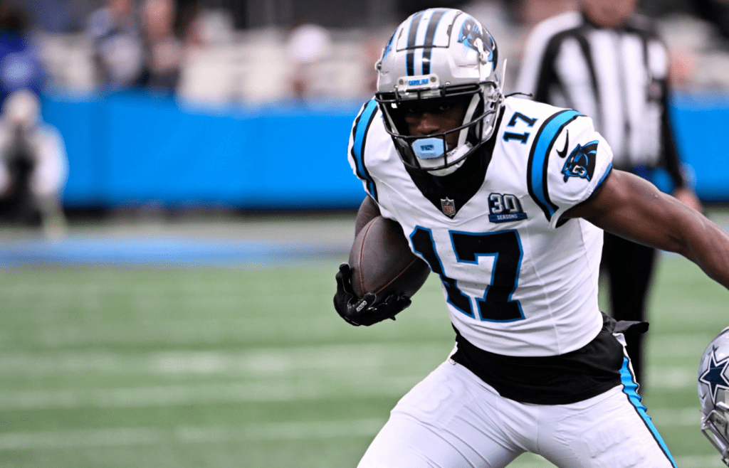 Dec 15, 2024; Charlotte, North Carolina, USA; Carolina Panthers wide receiver Xavier Legette (17) with the ball as Dallas Cowboys cornerback Amani Oruwariye (27) defefends in the first quarter at Bank of America Stadium. Mandatory Credit: Bob Donnan-Imagn Images