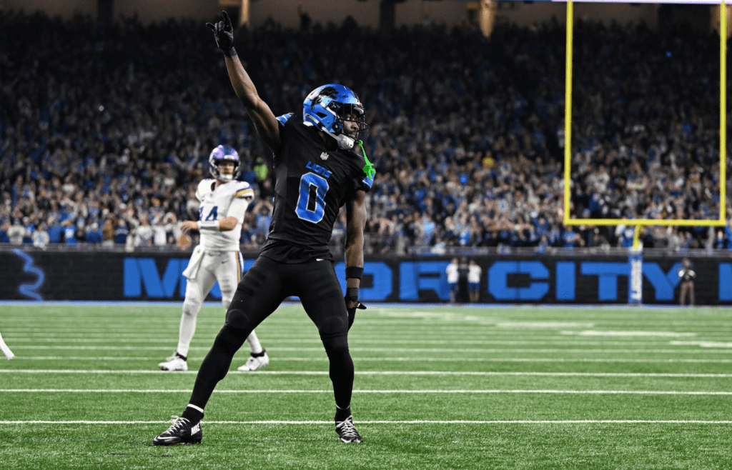 Jan 5, 2025; Detroit, Michigan, USA; Detroit Lions cornerback Terrion Arnold (0) celebrates after breaking up a fourth down pass by Minnesota Vikings quarterback Sam Darnold (14) in the end zone in the third quarter at Ford Field. The pass was incomplete.Mandatory Credit: Lon Horwedel-Imagn Images