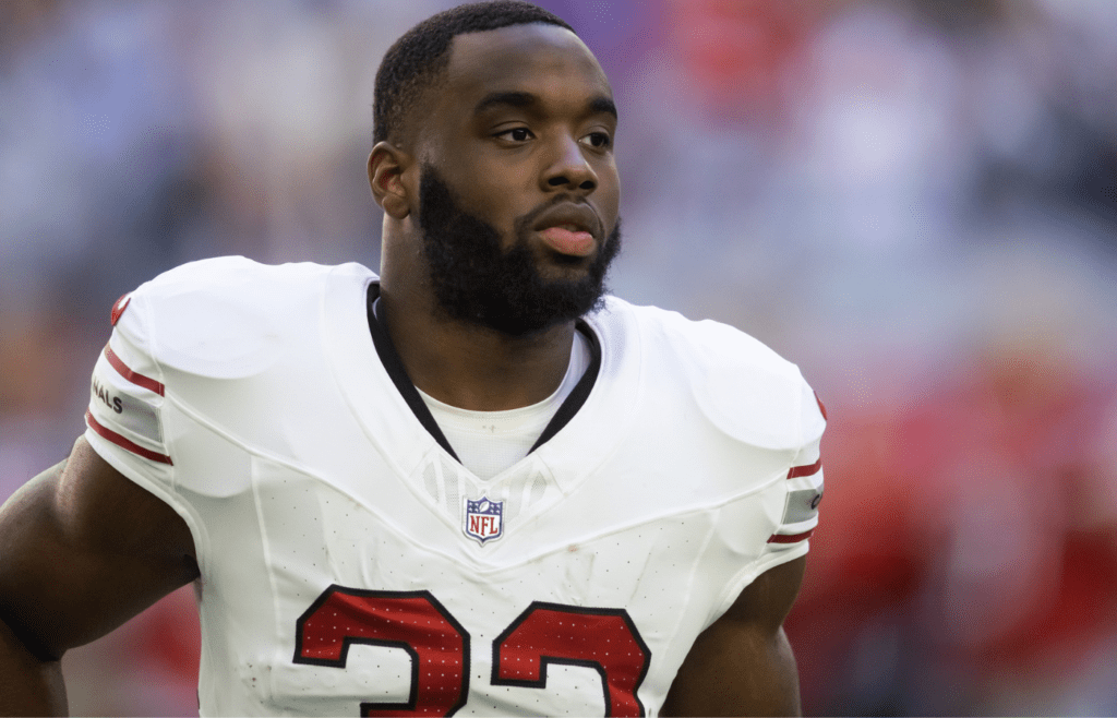 Dec 15, 2024; Glendale, Arizona, USA; Arizona Cardinals running back Trey Benson (33) against the New England Patriots at State Farm Stadium. Mandatory Credit: Mark J. Rebilas-Imagn Images